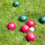 red and green balls in green field